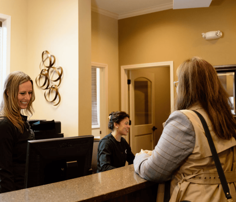 patient checking in at front desk